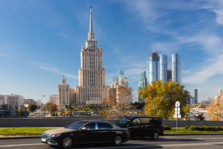 Moscow, Russia - October  14, 2021:  view of an autonomous city street with Mercedes-Benz Maybach S-class against the backdrop Radisson Royal Hotel Moscow, Hotel Ukraine.のeditorial素材