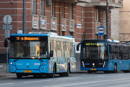 Moscow, Russia - October 14, 2021: blue new city electric buses stands at a stop against the...