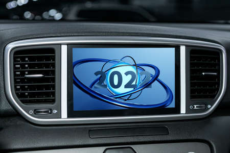 3D illustration close up Instrument automobile panel with monitor, which says Merry Christmas 2022. The concept of the new year and Christmas in the automotive fieldの写真素材