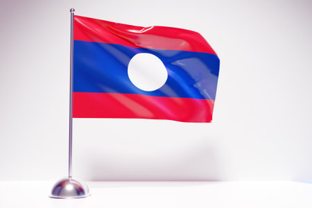 3D illustration of the national flag of Laos on a metal flagpole fluttering .Country symbol.の写真素材