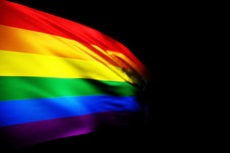 3D illustration of the LGBT flag fluttering against the black isolated background. Country symbol.の写真素材