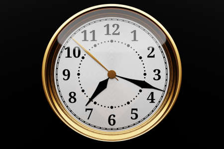3d illustration of a round gold clock with numbers on black isolated background. Time conceptの写真素材