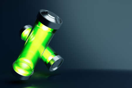 3d illustration of green batteries on black backgroundの写真素材