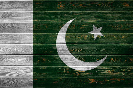 The national flag of Pakistan is painted on a camp of even boards nailed with a nail. The symbol of the country.の写真素材