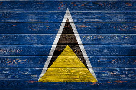 The national flag of Belgium is painted on a camp of even boards nailed with a nail. The symbol of the country.の写真素材