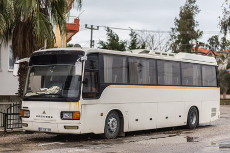 Side, Turkey -January 25, 2022: white bus Mitsubishi Princess is parked on the street on a warm summer day against the road and treesのeditorial素材
