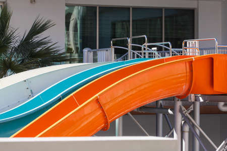 Close-up of a water park with high slides by the sea in a tourist cityの写真素材