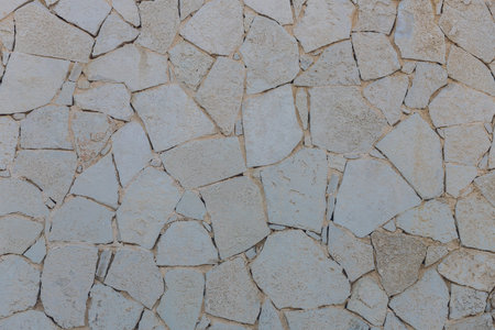 The texture of the stone wall. Background texture of the stone wall of the old castle.