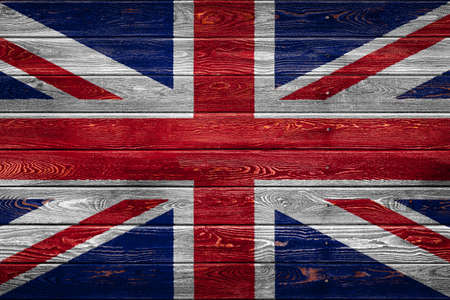 The national flag of the United Kingdom is painted on a camp of even boards nailed with a nail. The symbol of the country.の写真素材