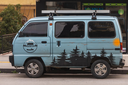 Side, Turkey -January 27, 2022: blue Suzuki Super Carry is parked on the street on a warm day against the backdrop of a shopsのeditorial素材