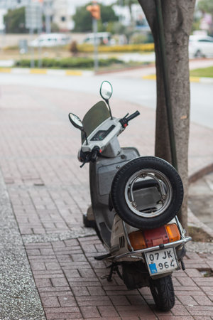 Side, Turkey -January 29, 2022: gray motocycle is parked on the street on a warm dayのeditorial素材