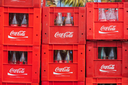Side, Turkey -January 30, 2022: close-up of empty glass bottles of coca cola in branded crates ready...
