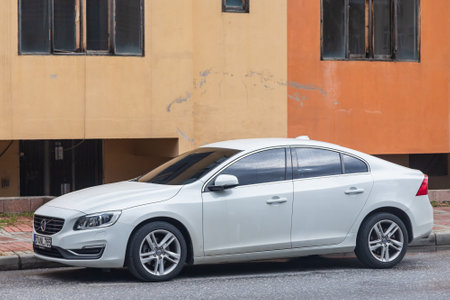 side; Turkey â February 01 2022: white Volve s60 is parked on the street on a warm day against the backdrop of a buildungのeditorial素材