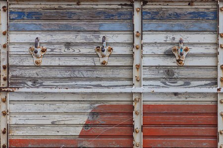 close-up of an old wooden truck body with hooks