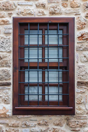 close-up of a beautiful black forged fence on a window in a old houseの写真素材
