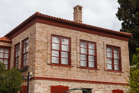 view of the old ancient house with red roof in Turkey. Side is a popular tourist destination in Turkey.の写真素材