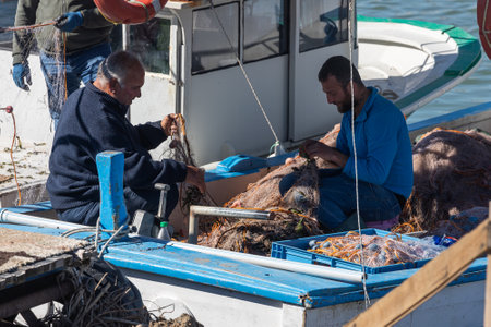 side; Turkey â February 02 2022: fishermen on a boat unwind the fishing netのeditorial素材
