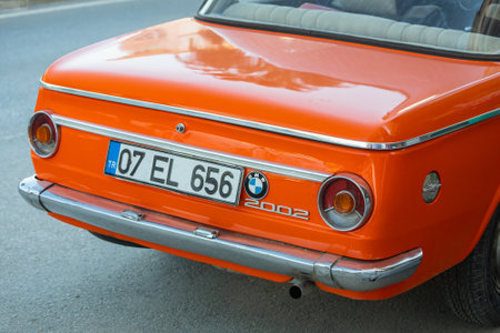 side; Turkey â February 13 2022: orange Bmw 2002 , trunk, wheel, bumper and taillightsのeditorial素材