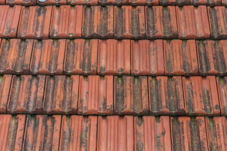 Close-up red tile roof. Pattern of roof texture and backgroundの写真素材