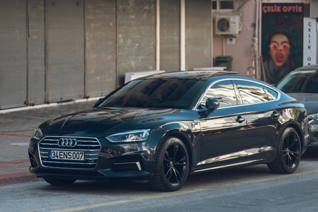 Moscow, Russia - October 13, 2021: black Audi A5 is parked on the street on a warm autumn day