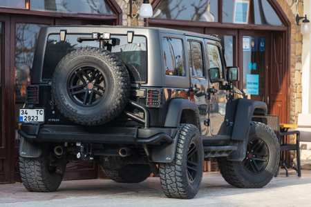 Side, Turkey -February 18, 2022: black Jeep Wrangler is parked on the street on a warm dayのeditorial素材