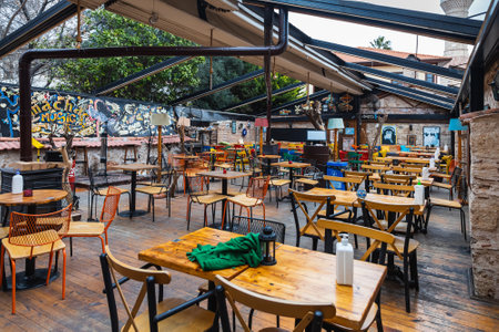 side; Turkey â February 20 2022: Atmospheric summer photography. Wooden cafe chairs, table. Outdoor street cafeのeditorial素材