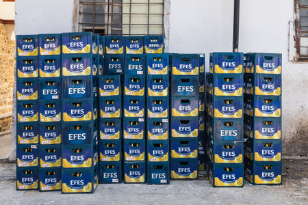 Side, Turkey -February 20, 2022: close-up of empty glass bottles of Efes in branded crates ready for recyclingのeditorial素材