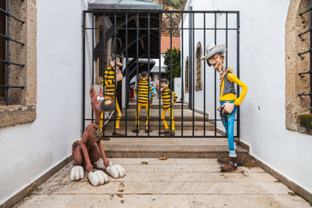 Antalya, Turkey - February 20, 2022: figurines of children with bandits, cowboys and dogsのeditorial素材