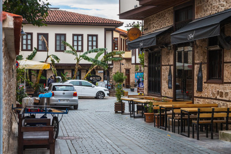 side; Turkey â February 20 2022: Atmospheric summer photography. Wooden cafe chairs, table. Outdoor street cafeのeditorial素材