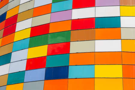 Close-up of a multi-colored wall of squares at the mallの写真素材