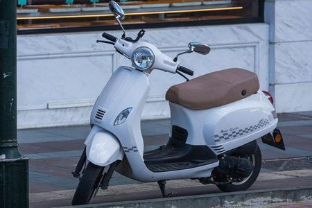 Antalya; Turkey â€“ March 04 2022: white retro motobike is parked on the street on a warm day