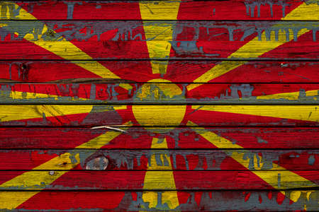 The national flag of Macedonia is painted on uneven boards. country symbol.の写真素材