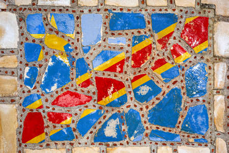National flag of the Democratic Republic of the Congo on stone wall background. Flag banner on stone texture background.の写真素材