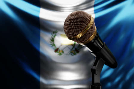 Microphone on the background of the National Flag of Guatemala, realistic 3d illustration. music award, karaoke, radio and recording studio sound equipmentの写真素材