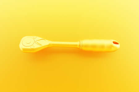 3D illustration of a yellow ratchet wrench hand tool isolated on a monocrome background. 3D render and illustration of repair and installation toolの写真素材