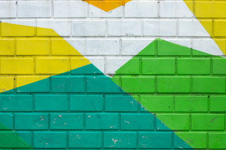 Colorful brick wall of an old building, background texture of a brick