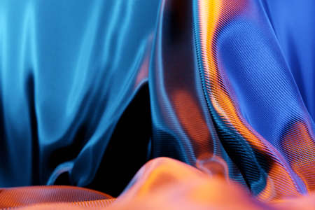 3d illustration of the texture of a blue natural fabric with folds. Abstract background from natural beautiful fabric close-up. Red curtains, stage curtainの写真素材