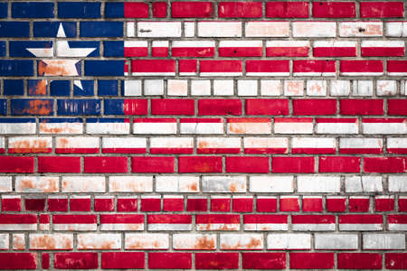 National flag of the Liberia on a grunge brick background.の写真素材