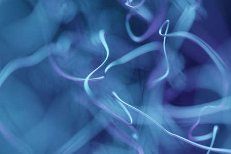 3d illustration chaotic blue lines spread in different directions on a black backgroundの写真素材