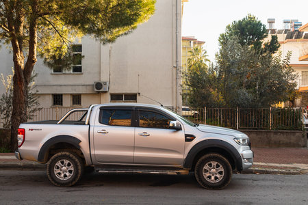 Side, Turkey -January 22, 2022: silver pickup Ford Ranger is parked on the street on a warm day...