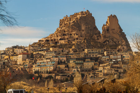 Goreme town on sunset in Cappadocia, Central Anatolia,Turkey. Morning view of the village of Goreme in Cappadocia on the background of the natural terrainのeditorial素材