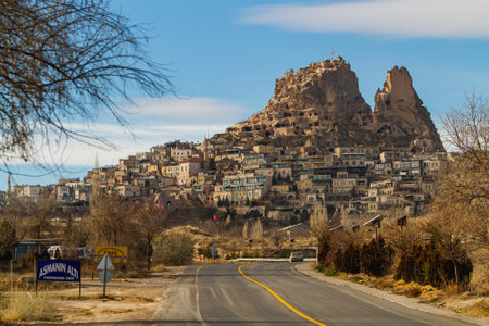 Goreme town on sunset in Cappadocia, Central Anatolia,Turkey. Morning view of the village of Goreme in Cappadocia on the background of the natural terrainのeditorial素材
