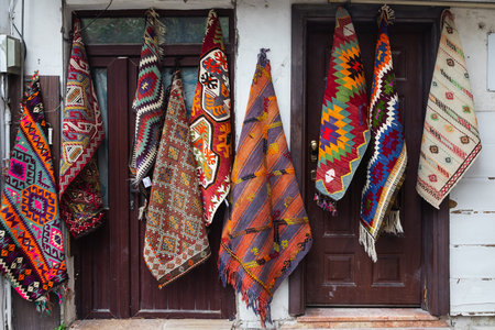 Antalya, Turkey- February 05, 2023: Carpets with oriental ornaments on the wall of a snow-white...