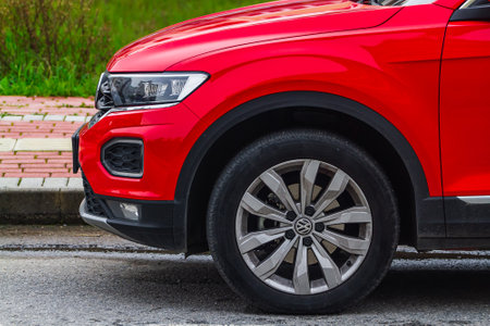 Side, Turkey â February 04 2023: red Volkswagen T-Roc car side view: fender, side glass, wheel, bumper and hoodのeditorial素材