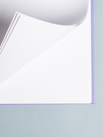White paper sheet background isolated on blue, close upの写真素材