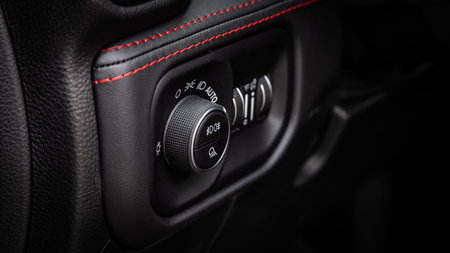 Novosibirsk, Russia - April 25, 2023: Dodge Ram Trx, close-up of headlights adjustment buttons....