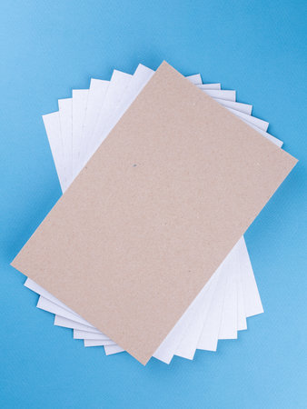 Beige kraft paper texture, high resolution abstract background. cardboard sheet background isolated on blue, close upの写真素材