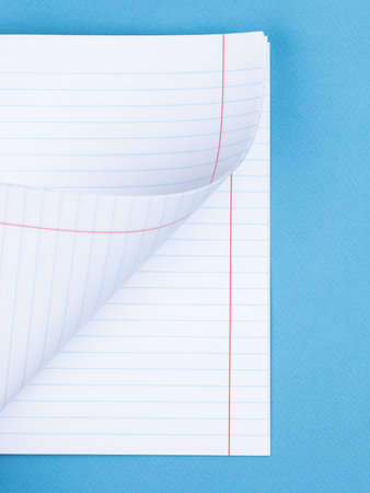 White paper sheet background isolated on blue, close up