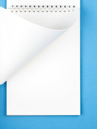 White paper sheet background isolated on blue, close upの写真素材
