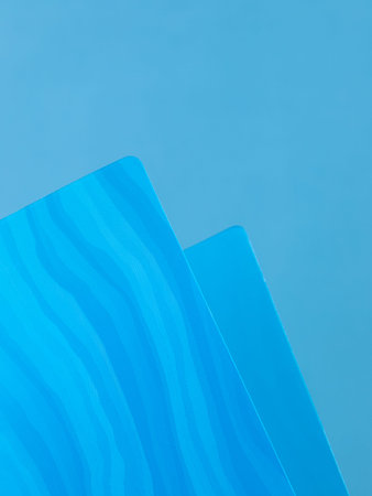 Close-up view of blue plastic document folder on office table
